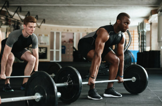 storyblocks group of multiracial sports people working out with barbells in the gym rAewgChTcb