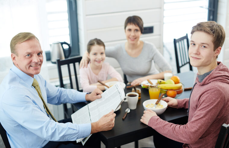storyblocks high angle view of lovely family posing for photography while eating healthy breakfast at home waist up portrait S8e8UrwAb