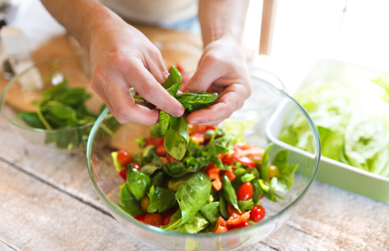 graphicstock unrecognizable man preparing ingredients for vegetable salad r0Llziab