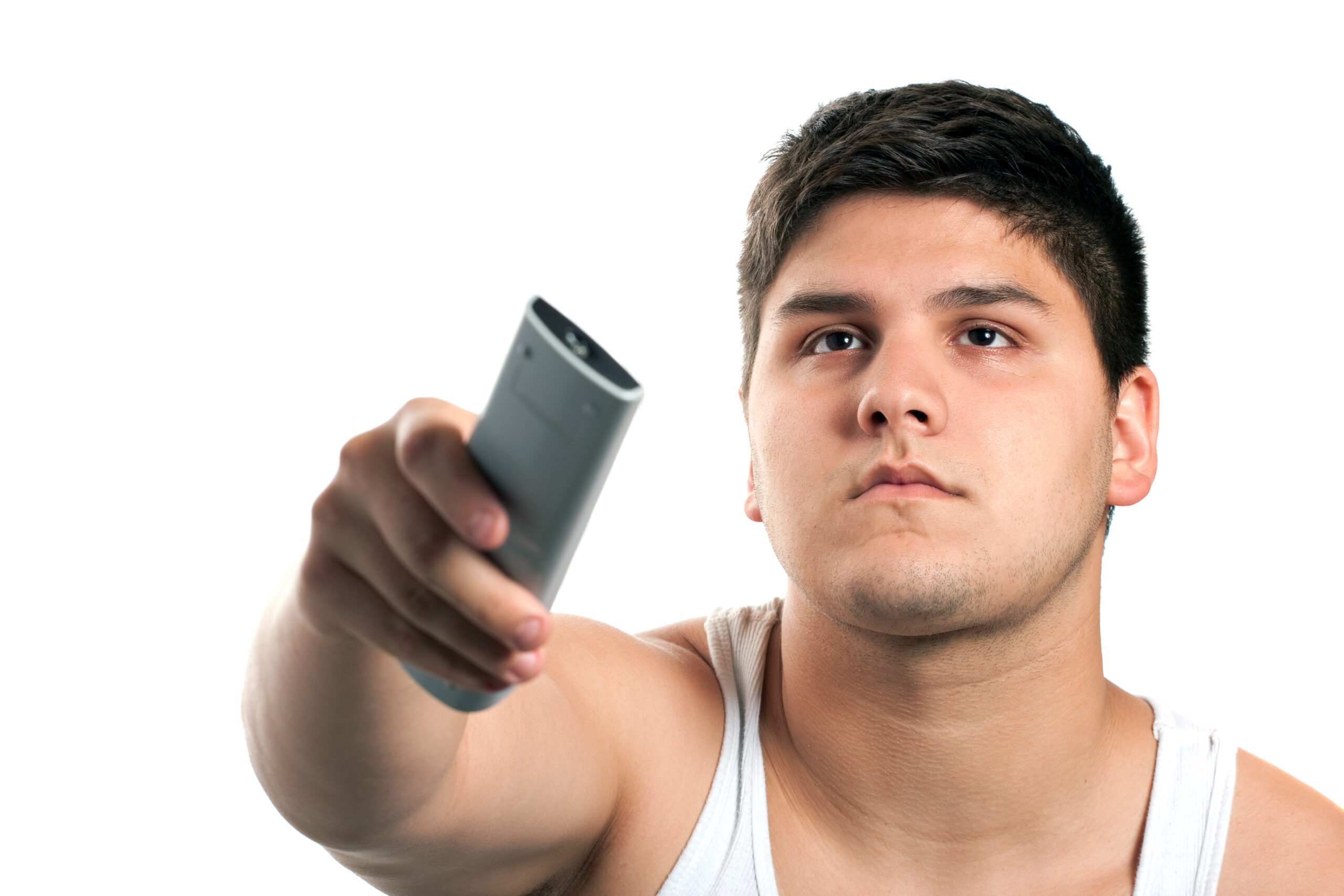 a teenager changes the channel with the remote control isolated over a white background shallow depth of field SYmgv0YCSs scaled